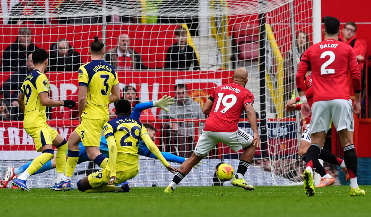 Manchester United's Bryan Mbeumo scores their side's first goal. Pic: Martin Rickett/PA Wire.