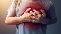 Adult male with heart attack or heart burn condition, health and medicine concept