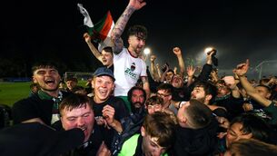 <p>Cork City’s Seani Maguire celebrates winning the First Division and getting promoted to the Premier Division with fans in 2024. Pic: ©INPHO/Morgan Treacy</p>