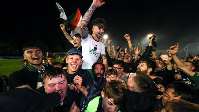 <p>Cork City’s Seani Maguire celebrates winning the First Division and getting promoted to the Premier Division with fans in 2024. Pic: ©INPHO/Morgan Treacy</p>