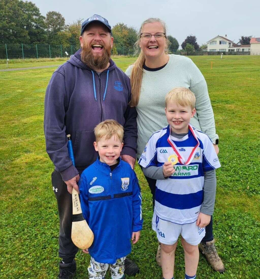  Cornelius Patrick O'Sullivan, wife Noelle, and sons, Hunter and Harvey (with medal).