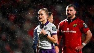 <p>HISTORY MAKER: Referee Hollie Davidson reviews a TMO decision during a Munster match. Pic: Tyler Miller/Sportsfile.</p>
