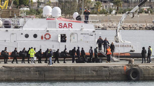 <p>Migrants board an Italian Coast Guard vessel as part of a transfer operation from the asylum processing centres in Albania in February 2025.  File picture: Vlasov Sulaj/AP</p>