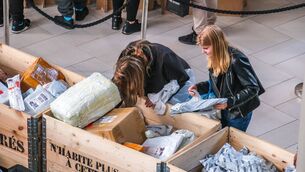 <p>Customers rummaging at a King Colis pop-up</p>