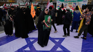 People have marked the event in Tehran and elsewhere (AP)