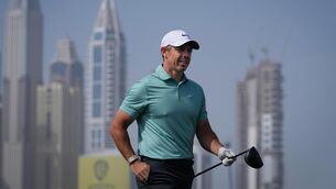 <p>Rory McIlroy of Northern Ireland walks down the 8th fairway during the final round of the Dubai Desert Classic. Pic: Altaf Qadri/AP</p>