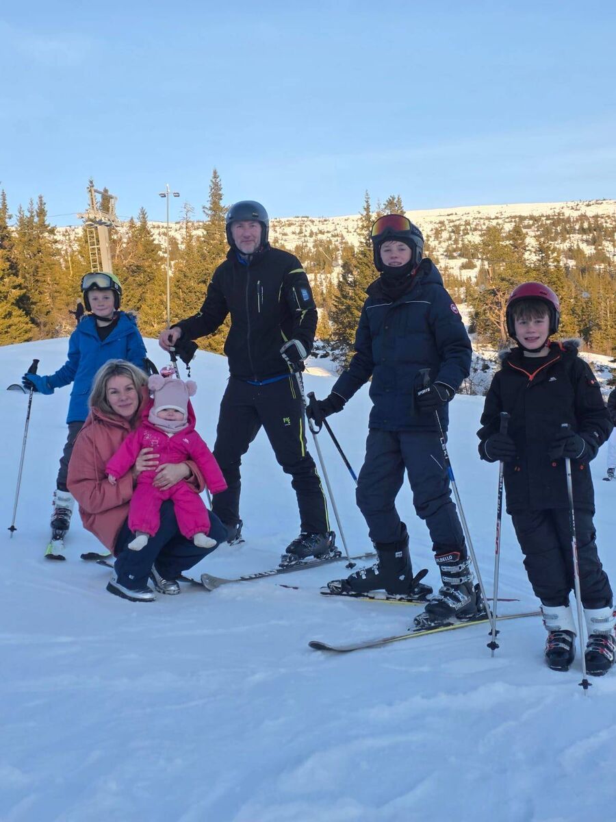 Marie Crowe with Jessie, husband Billy, and sons on a skiing trip.