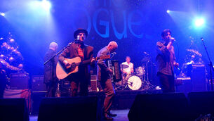 <p>The Pogues performing with Andrew Ranken (Joel Ryan/PA)</p>