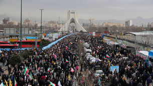 People attend an annual rally marking the 1979 Islamic Revolution (Vahid Salemi/AP)