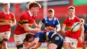 <p>CBC’s Sam Healy is tackled by Alan Cleary of Crescent College Comp. Pic: Tom O’Hanlon/Inpho</p>