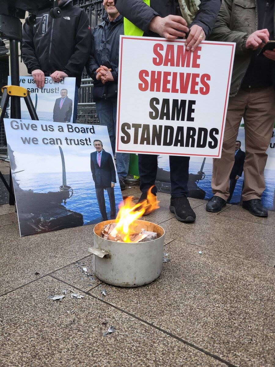 Farmers burn their Bord Bia paperwork outside the Dáil ahead of Larry Murrin going before the agricultural committee. Picture: Zoe Geary