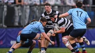 <p>Aodhán Carroll of Cistercian College, Roscrea in action against Myles Berman of St Michael's College during their Leinster Schools Senior Cup quarter-final. Pic: Shauna Clinton/Sportsfile</p>