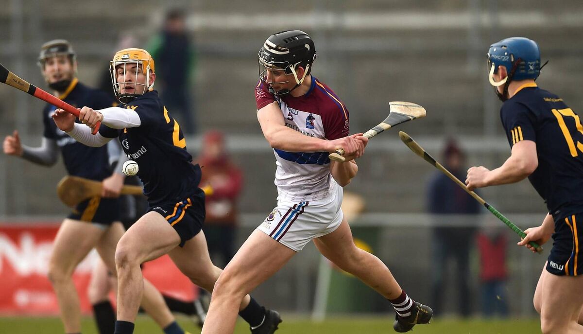 Gearóid Hegarty of UL in action against Stephen Roche, left, and John Donnelly of DCU Dochas Eireann during the Electric Ireland HE GAA Fitzgibbon Cup Final match between DCU Dochas Eireann and University of Limerick at Mallow GAA Grounds in Mallow, Co Cork. Photo by Diarmuid Greene/Sportsfile