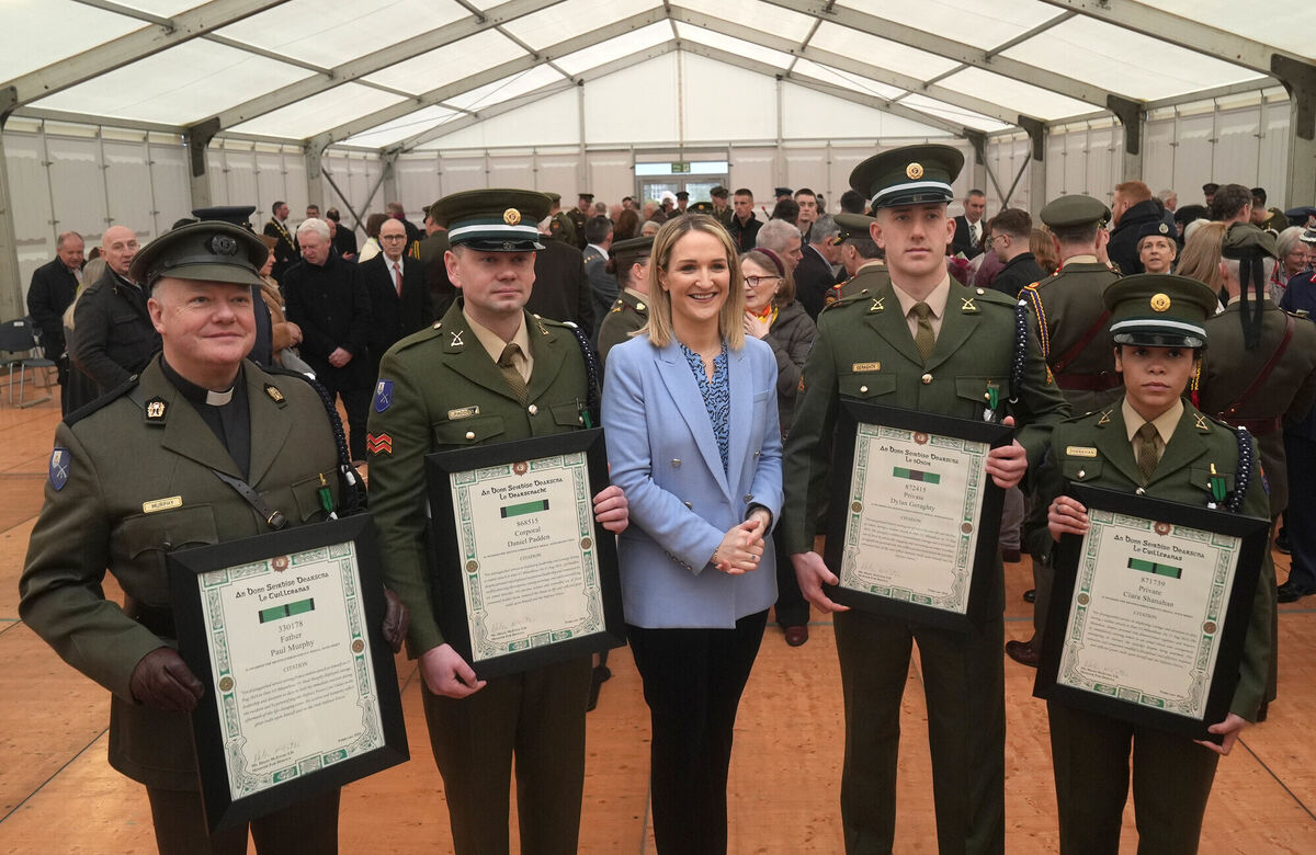 Minister for defence Helen McEntee (centre, with left to right) Father Paul Murphy with his Distinguished Service Medal (DSM) with Merit, Corporal Daniel Padden with his DSM, with Distinction, Private Dylan Geraghty with his DSM, with Honour, and Private Ciara Shanahan with her DSM with Merit, at Dun Ui Mhaoiliosa in Renmore Barracks on Thursday. Photo: Brian Lawless/PA