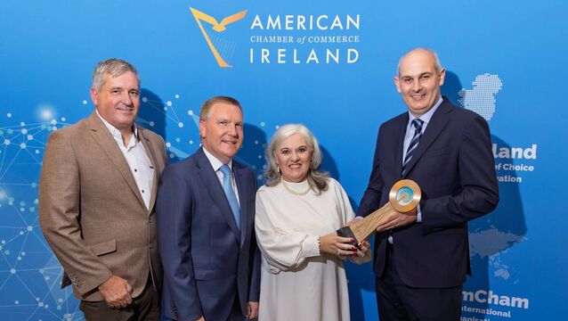 <p>AmCham vice-president Mark Cockerill (now president), and Commissioner Michael McGrath presenting the 2025 Southern region Cairdeas award to Karen O’Mahony and Jon O’Mahony - The Rainbow Club, at the 2025 AmCham Southern Dinner. </p>