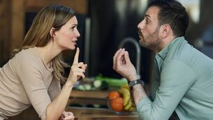Young couple having an argument at home.