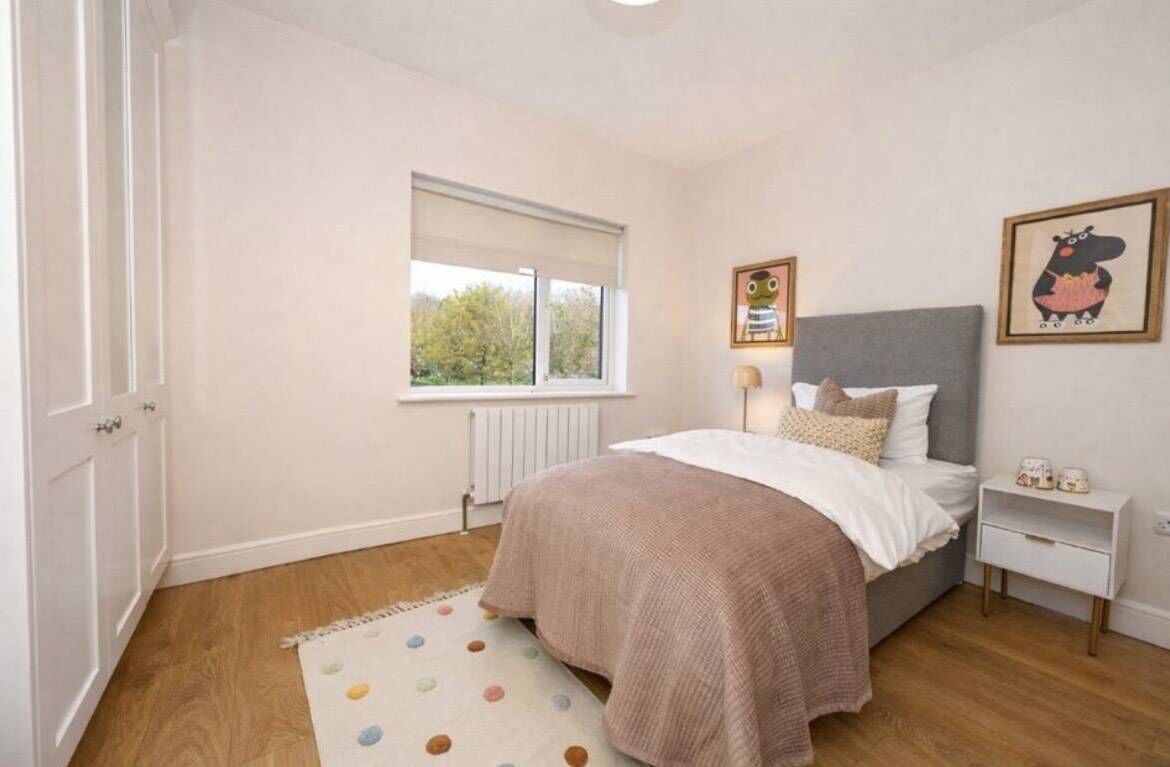 A bedroom staged by Dara Carey.