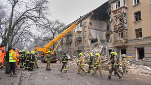 <p>Rescue workers clear the rubble of a residential building which was damaged after a Russian strike in Odesa last month.</p>