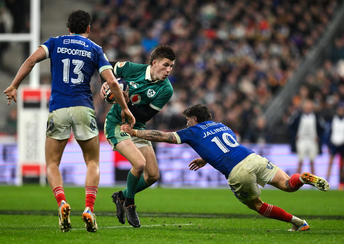 PARIS BLUES: Sam Prendergast of Ireland is tackled by Matthieu Jalibert of France. Pic: Brendan Moran/Sportsfile