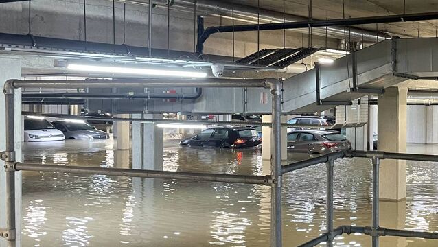 <p>Cars stand in flood water in an underground car park in north Dublin which flooded after heavy rain overnight. Picture: Grainne Ni Aodha/PA Wire</p>