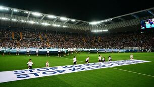 <p>Mascots hold a banner which reads "Stop killing children, Stop killing civilians" on the pitch ahead of the 2025 UEFA Super Cup final football match between Paris Saint-Germain (FRA) and Tottenham Hotspur FC (ENG) at the Friuli stadium, in Udine, on August 13, 2025.  Photo by MARCO BERTORELLO/AFP via Getty Images </p>