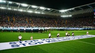 <p>Mascots hold a banner which reads "Stop killing children, Stop killing civilians" on the pitch ahead of the 2025 UEFA Super Cup final football match between Paris Saint-Germain (FRA) and Tottenham Hotspur FC (ENG) at the Friuli stadium, in Udine, on August 13, 2025.  Photo by MARCO BERTORELLO/AFP via Getty Images </p>