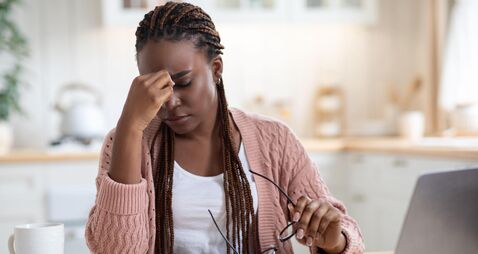 Eyes Strain. Overworked Black Freelancer Woman Tired After Using Laptop In Kitchen