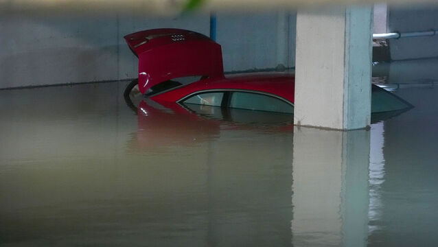 <p>Cars stand in flood water in an underground car park in north Dublin.Picture: Brian Lawless/PA Wire</p>