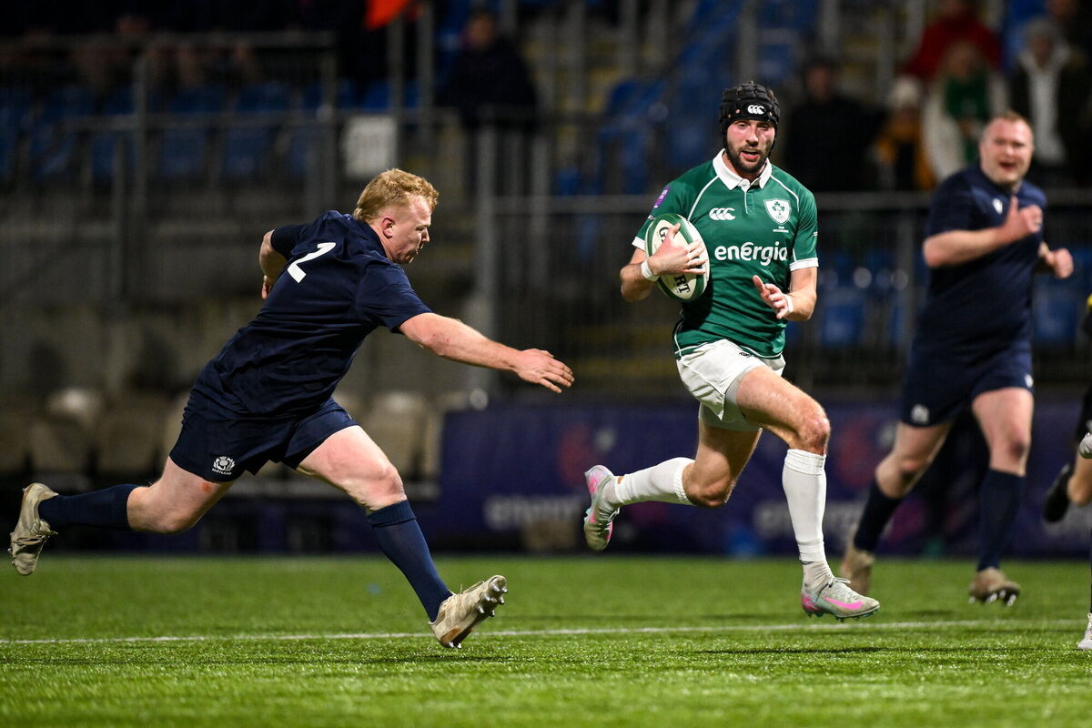 Aaron Sexton breaks away from Fraser Renwick of Scotland. Pic: Brendan Moran/Sportsfile