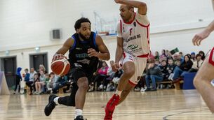 <p>Jordan Perkins of Warriors and Josh Steel of Ballincollig in action during the game which was played to a packed hall. Pic: Domnick Walsh/Eye Focus</p>