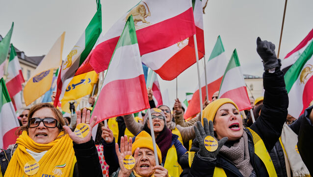 Supporters of the Iranian opposition group People’s Mujahedeen Organisation of Iran attend a protest in Munich (Ebrahim Noroozi/AP)