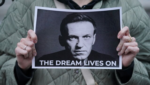 <p>A protester holding a picture of Alexei Navalny at a protest opposite the Russian Embassy in London in 2024. Picture: Jonathan Brady/PA</p>