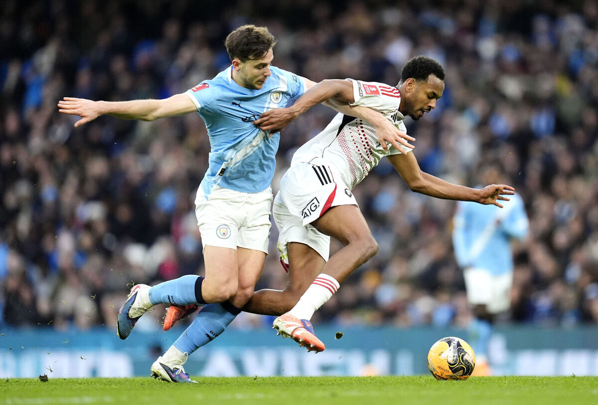 Manchester City's Nico Gonzalez (left) and Salford City's Zachariah Awe battle for the ball. Pic: Nick Potts/PA