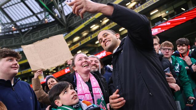 <p>PORTRAIT MODE: Ireland's Cormac Izuchukwu takes a selfie with fans after the match. Pic: INPHO/Ben Brady</p>
