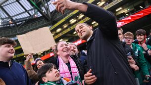 <p>PORTRAIT MODE: Ireland's Cormac Izuchukwu takes a selfie with fans after the match. Pic: INPHO/Ben Brady</p>