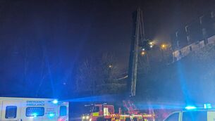 <p>Members of Cork City Fire Brigade used a hydraulic platform to perform 'a long and complicated rescue' on Saturday night after a man fell more than 30 feet. Picture: Cork City Fire Brigade</p>
