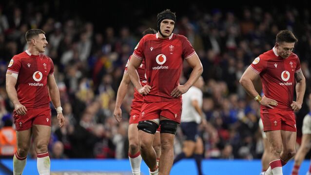 <p>Wales players appear dejected during their 54-12 Six Nations defeat to France. Pic: Andrew Matthews/PA</p>