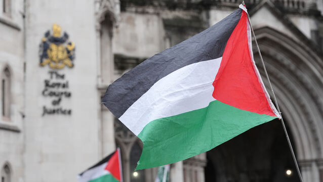 <p>Protesters with Palestinian flags outside the High Court, central London (Picture; Jonathan Brady/PA)</p>