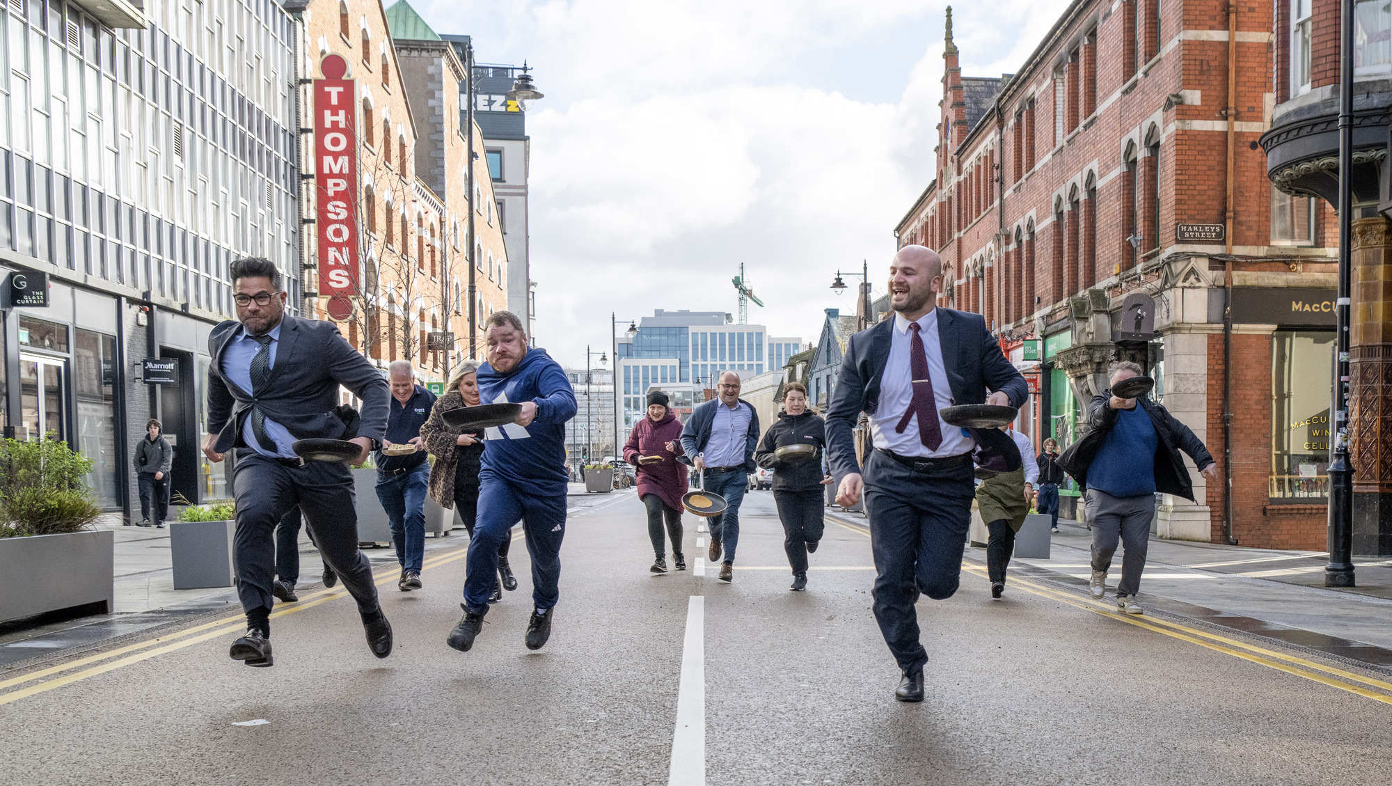 'I'll remember to bring my runners next time': Cork City traffic stops for pancake race