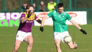 <p>Danny Neville of Limerick clearing the ball against Marcas Rossiter in the Allianz Football League Division 3 clash which Limerick won with a last-gasp goal. Pic: Brendan Gleeson</p>
