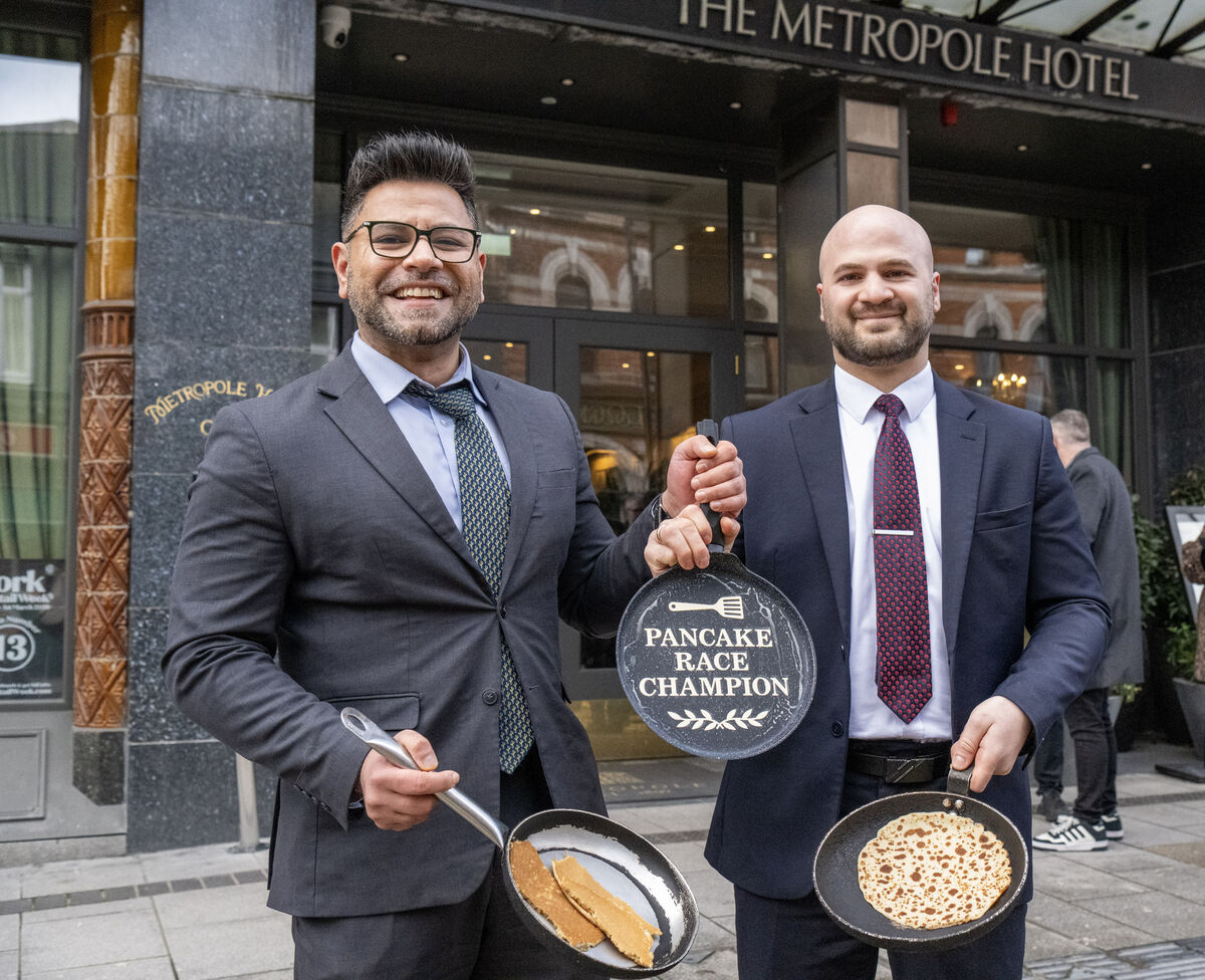 Azim Ali (left) and Robert Bejanishvili (right) sharing the spoils at the Metropole Hotel’s annual pancake race in Cork City. Picture: Brian Lougheed Azim Ali (left) and Robert Bejanishvili (right) sharing the spoils at the Metropole Hotel’s annual pancake race in Cork City. Picture: Brian Lougheed