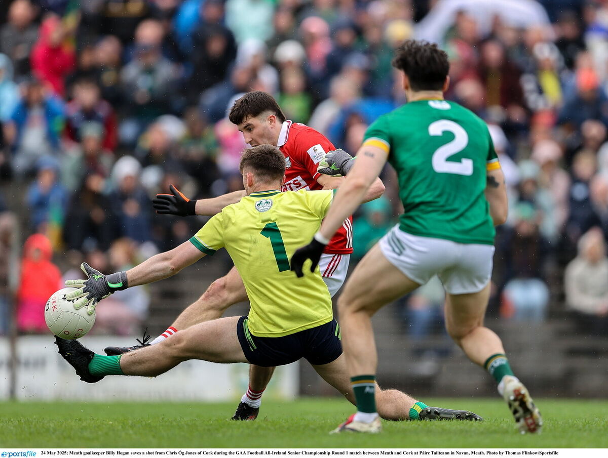 Meath goalkeeper Billy Hogan saves a shot from Chris Óg Jones. Pic: Thomas Flinkow/Sportsfile.