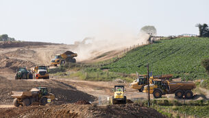 <p>Earth moving trucks taking part in the construction of the new M28 Cork to Ringaskiddy road project, at Shannonpark, Carrigaline, Co Cork, last year. Picture: David Creedon</p>