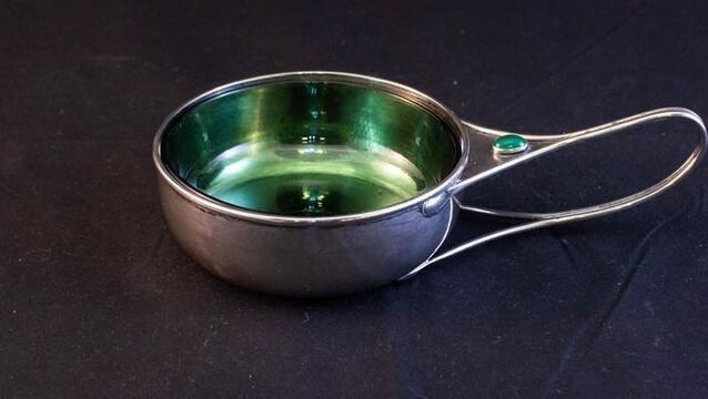 <p>An arts and crafts silver porringer with green glass liner at Keighery's.</p>