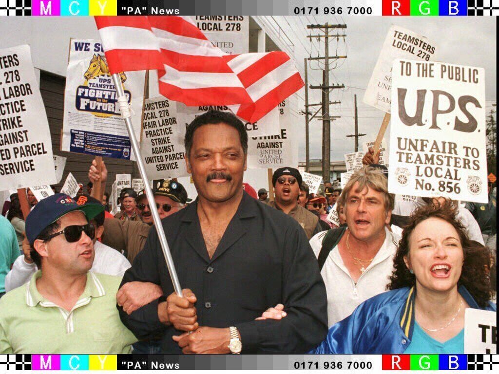 The Rev. Jesse Jackson marches with striking United Parcel Service workers outside UPS in San Francisco, Sunday, Aug. 10, 1997. Approximately 125 workers picketed the facility at the end of the first week of the strike. Picture: AP Photo/Dwayne Newton