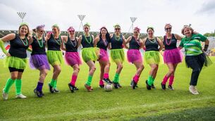 <p>Douglas G4M&amp;O team stepping on to the pitch at SuperValu Páirc Uí Chaoimh.</p>