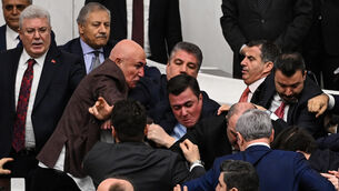 Turkey’s ruling party and opposition lawmakers clash in parliament (Ugur Yildirim/DIA Photo via AP)