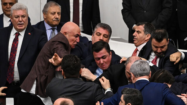 Turkey’s ruling party and opposition lawmakers clash in parliament (Ugur Yildirim/DIA Photo via AP)