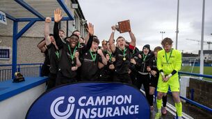 <p>CHAMPIONS AGAIN: Maynooth University captain Dean O'Shea lifts the Collingwood Cup following their 2-0 win over UL in the final at Jackman Park, Limerick. Picture by: Mark Nolan</p>