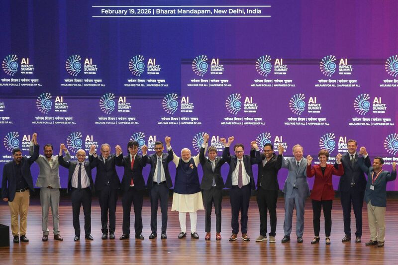 India's Prime Minister Narendra Modi takes a group photo with AI company leaders at the AI Impact Summit in New Delhi on Thursday. Picture: Ludovic Marin/Getty Images